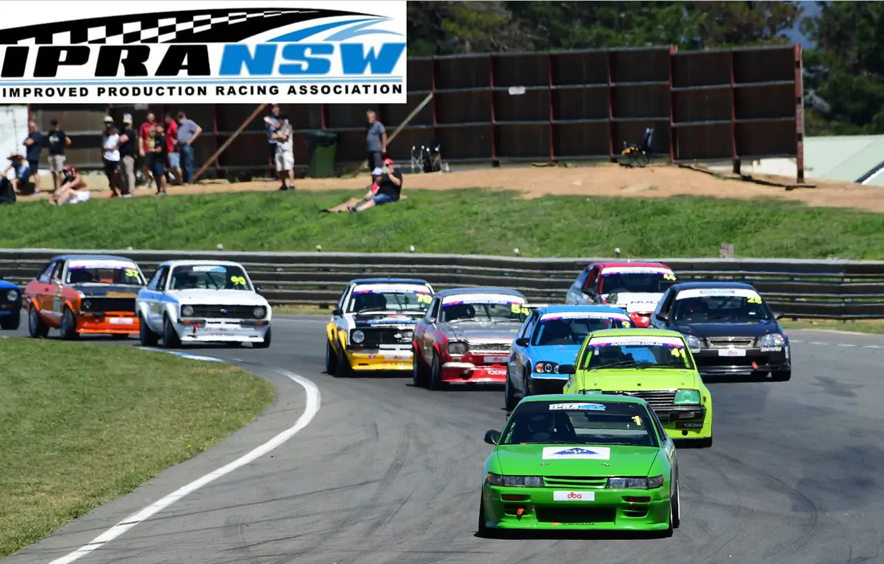 IPRA NSW Improved Production racing cars competing on circuit track with DBA brake sponsorship visible on vehicles during Australian motorsport event