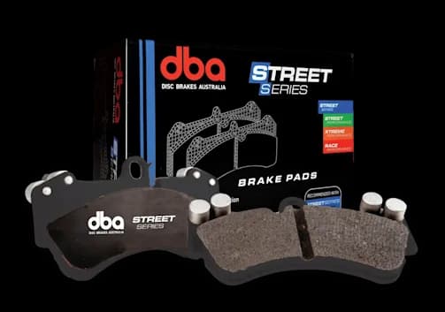 DBA Street Series brake pads featuring black backing plates with friction material shown alongside retail packaging box