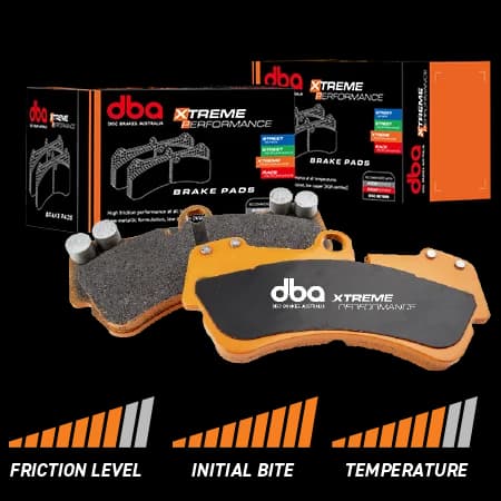 DBA Xtreme Performance brake pads with orange backing plates and friction material displayed alongside retail packaging box