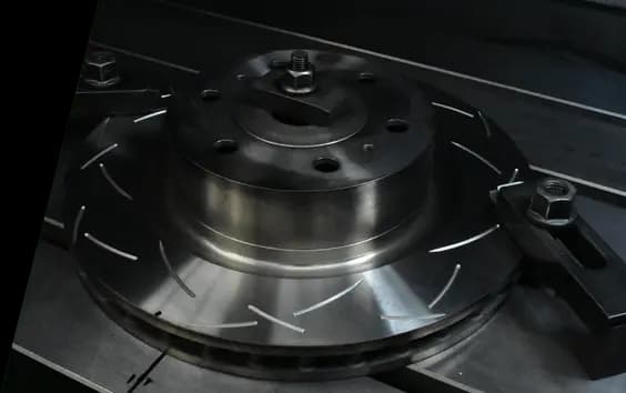 DBA brake rotor made with XG-150 cast iron showing slotted surface pattern and precision-machined hub mounting surface